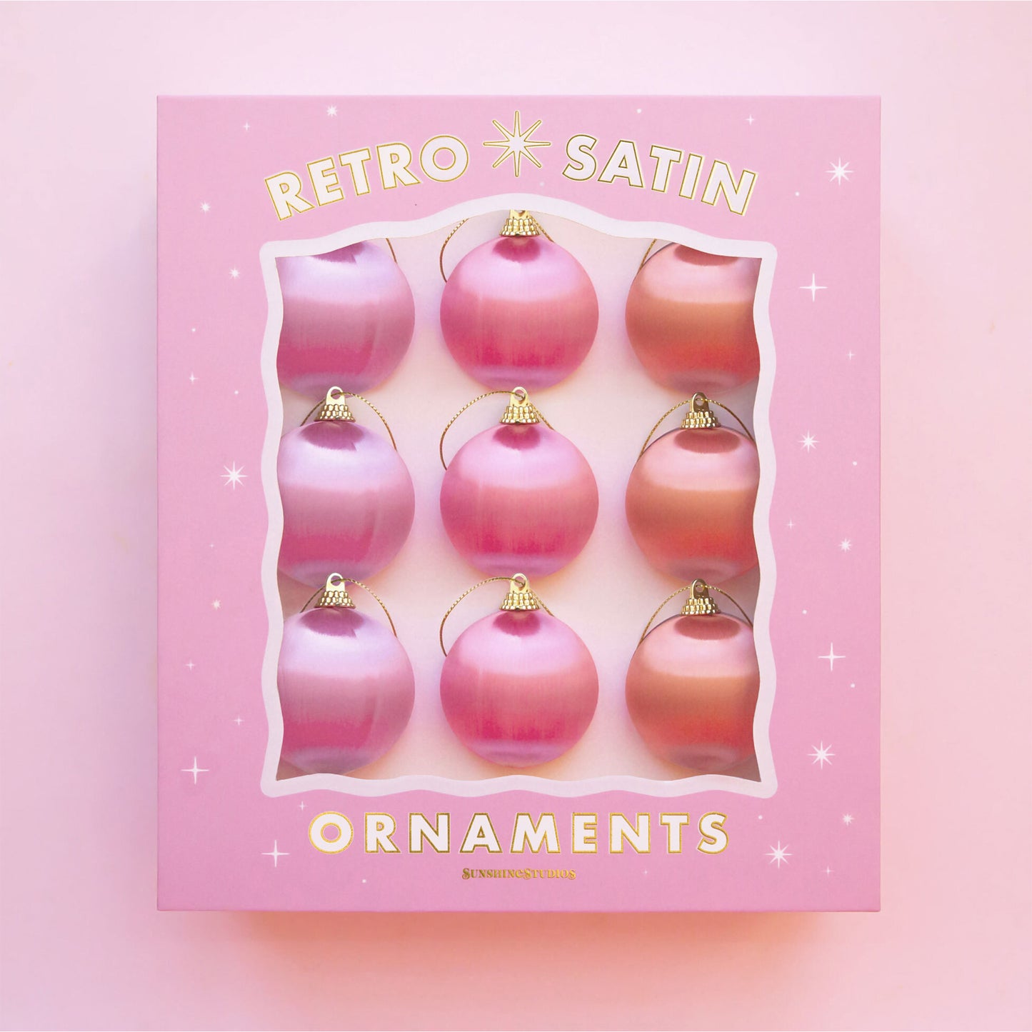 Box of satin ball Christmas ornaments. The balls are pink, orange and purple colors. The box read, "Retro Satin Ornaments" with gold accents.