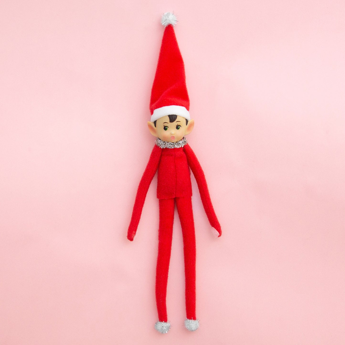 A red elf shaped ornament.