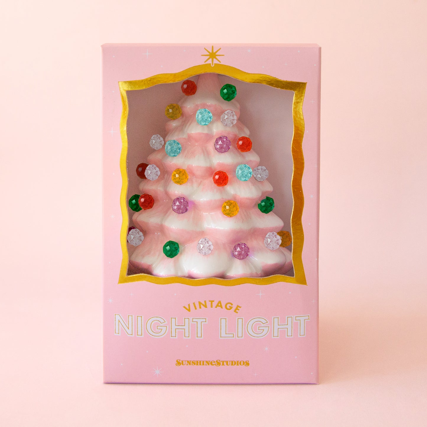 Baby pink christmas tree night light with multi colored round bulbs in a decorative box.