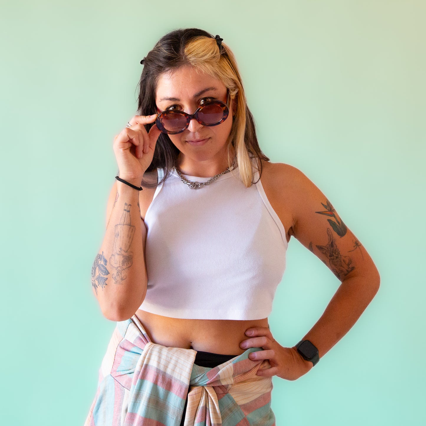 A round tortoise pair of sunglasses with brown lenses.