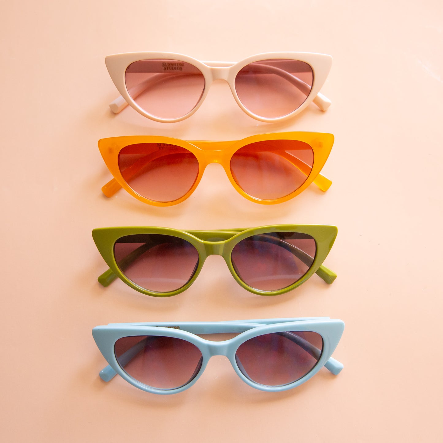 All the color ways of the Frenchie sunglasses lined up in a photo.