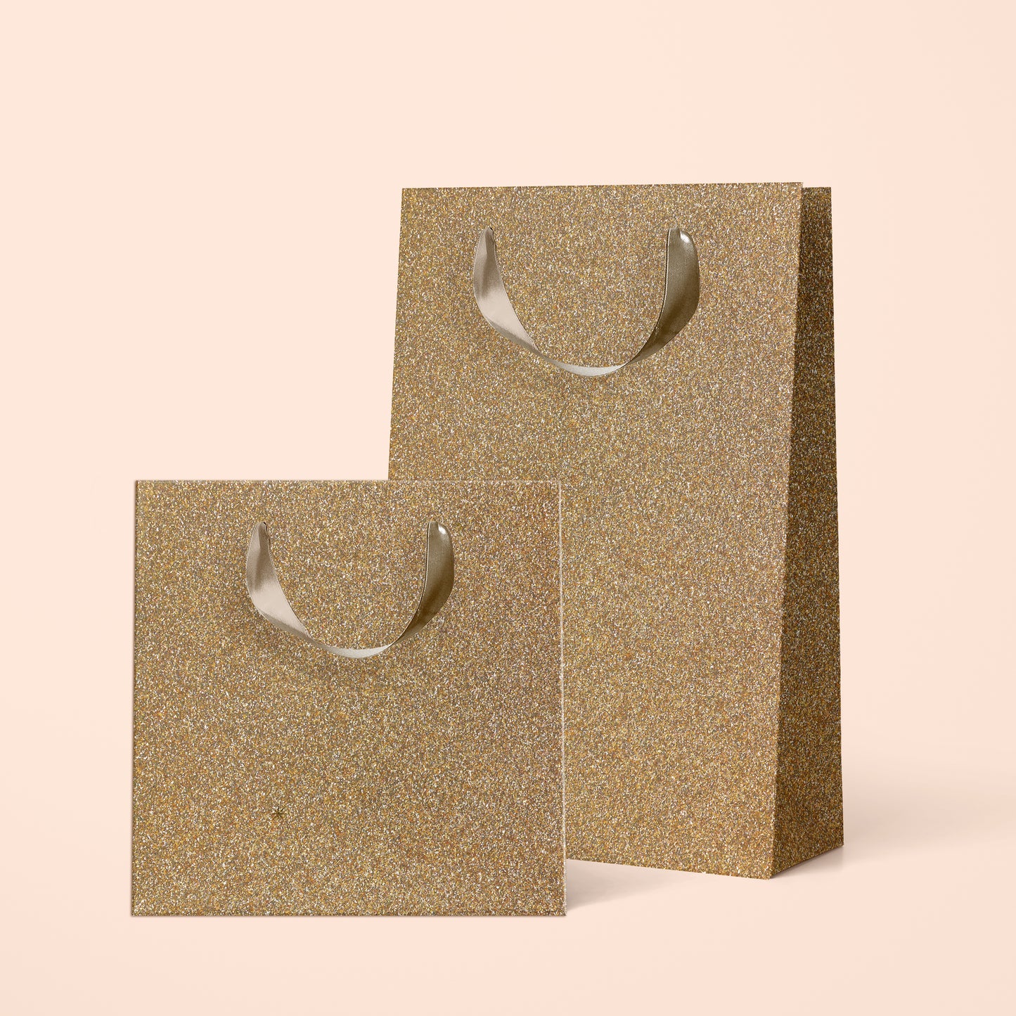 Two different sized gold sparkle gift bags.