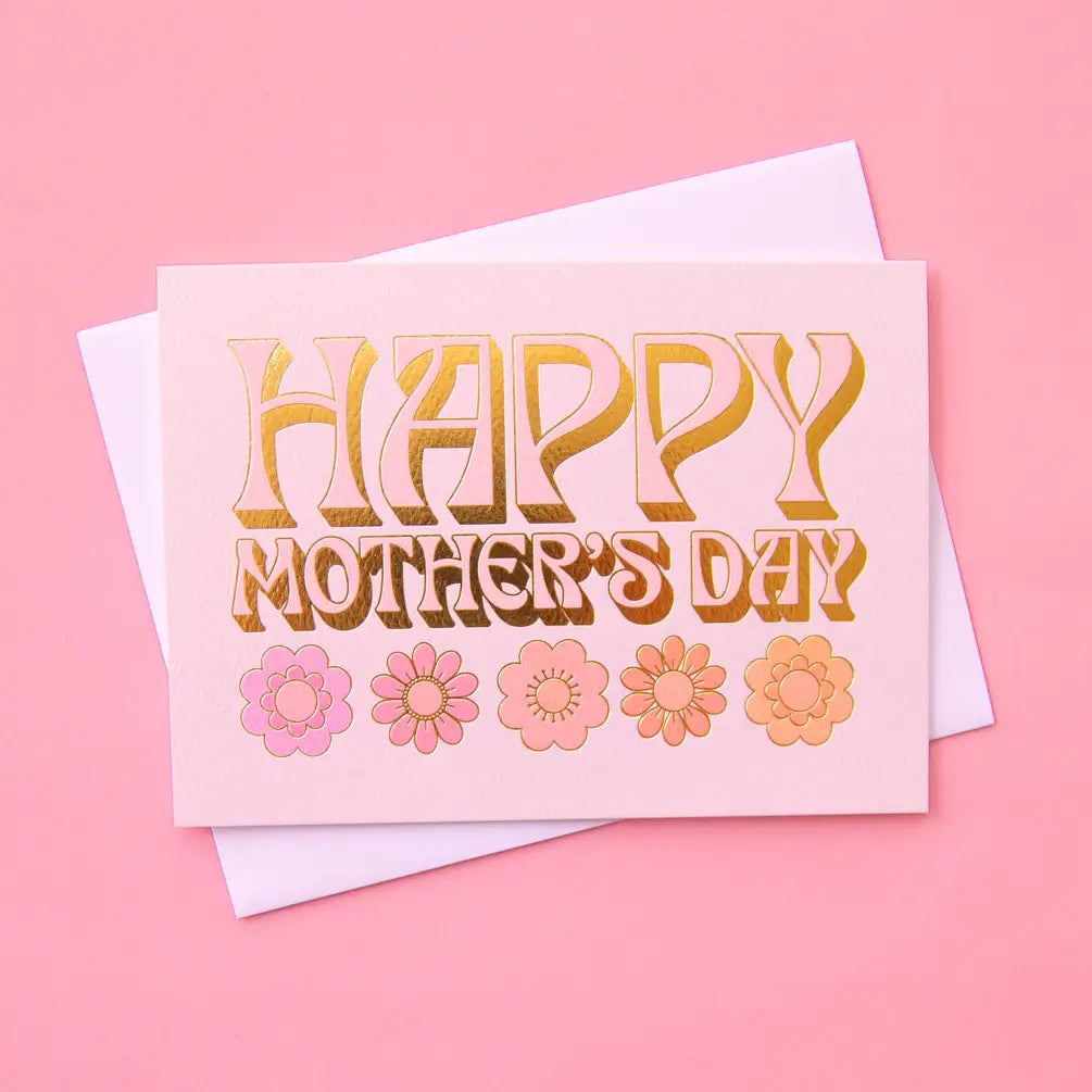 On a pink background is a light pink card that reads, "Happy Mother's Day" with five daisies underneath.