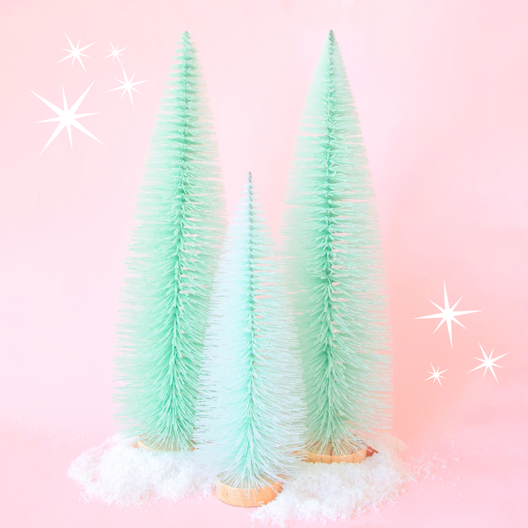 Mint Colored Sisal Christmas trees on a pink background.