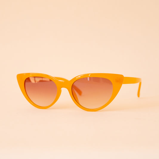 A pair of cat-eye shaped yellow sunglasses. 