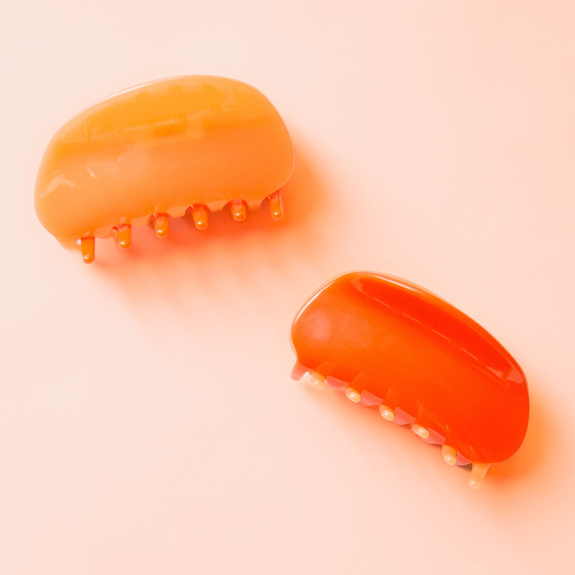 A two-toned rounded claw clip in shades of orange. 