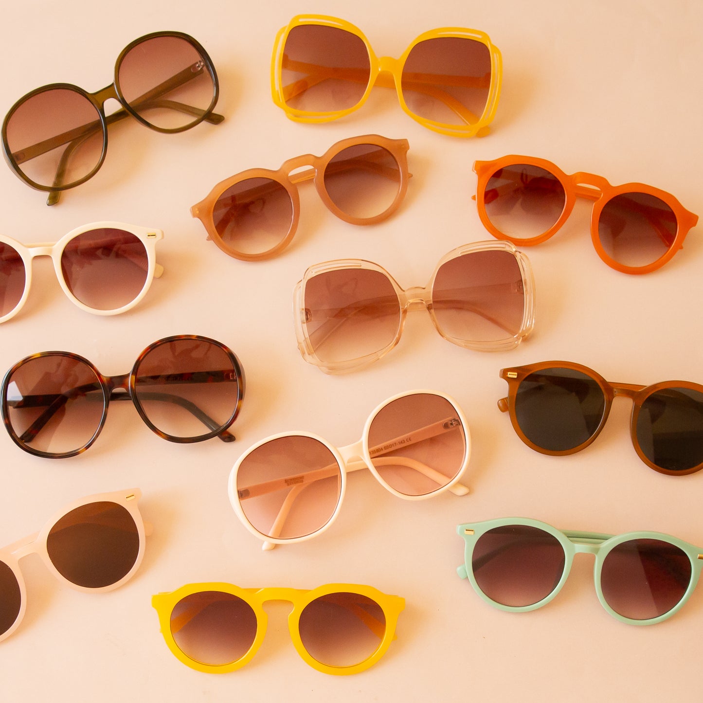 The three circle Bardot sunglasses in different colors. Ivory, Juniper and cognac.