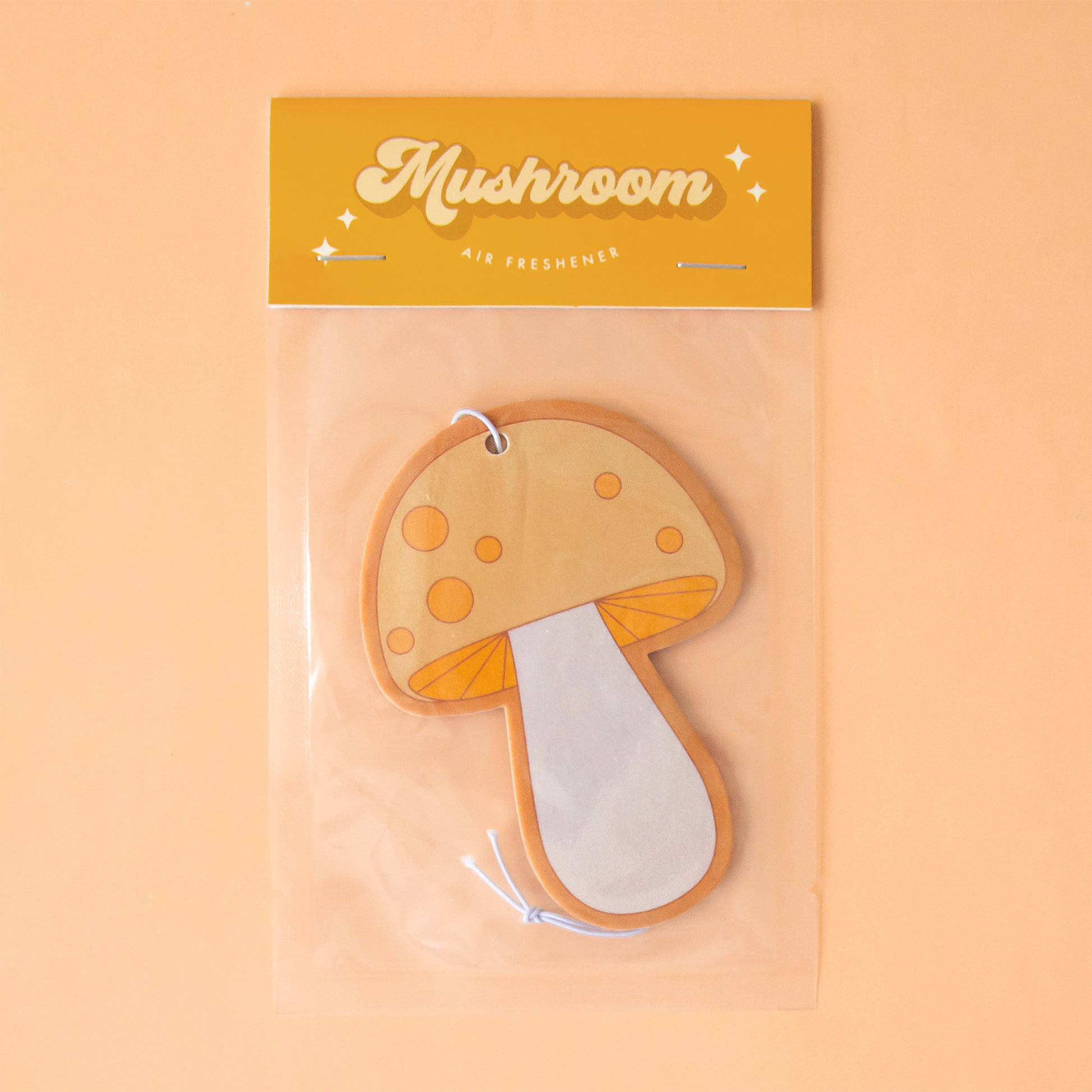 A yellow and orange mushroom shaped air freshener.