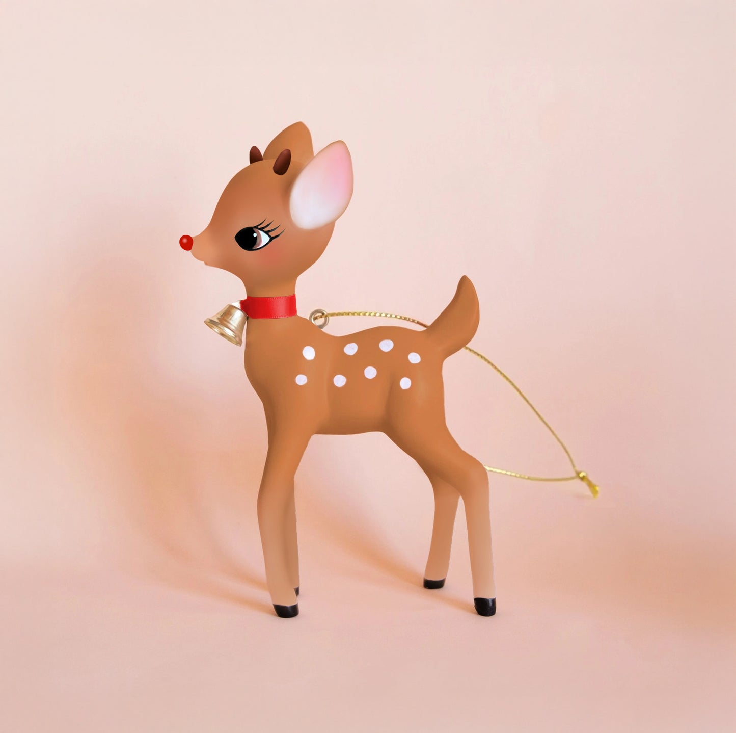 A brown retro deer ornament with a red nose. 