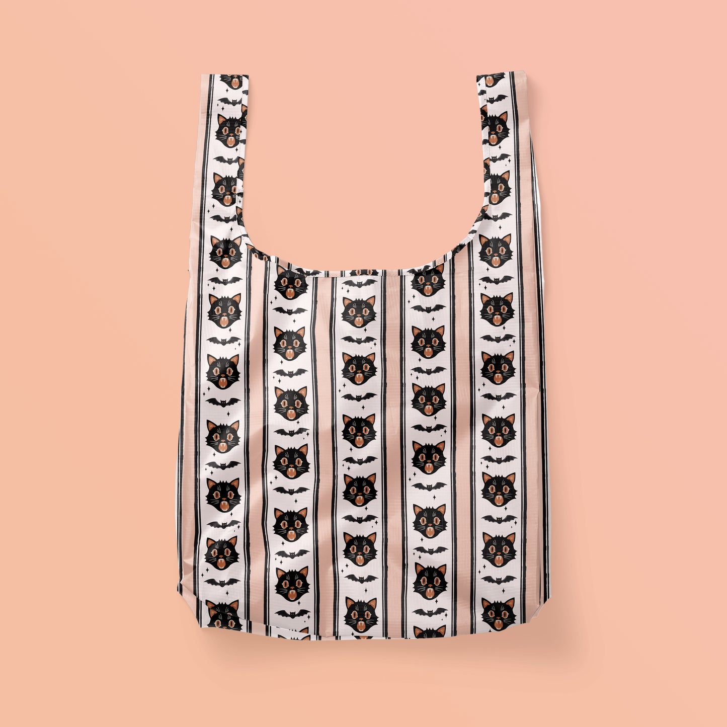 Reusable tote bag with black cats and bats in a vertical stripe pattern. 