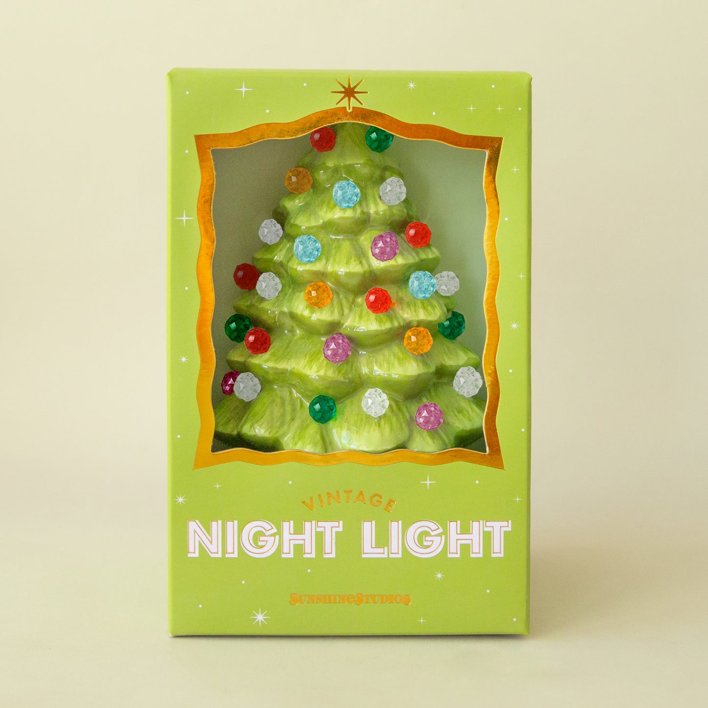Lime green christmas tree night light with multi colored round bulbs in a decorative box. 