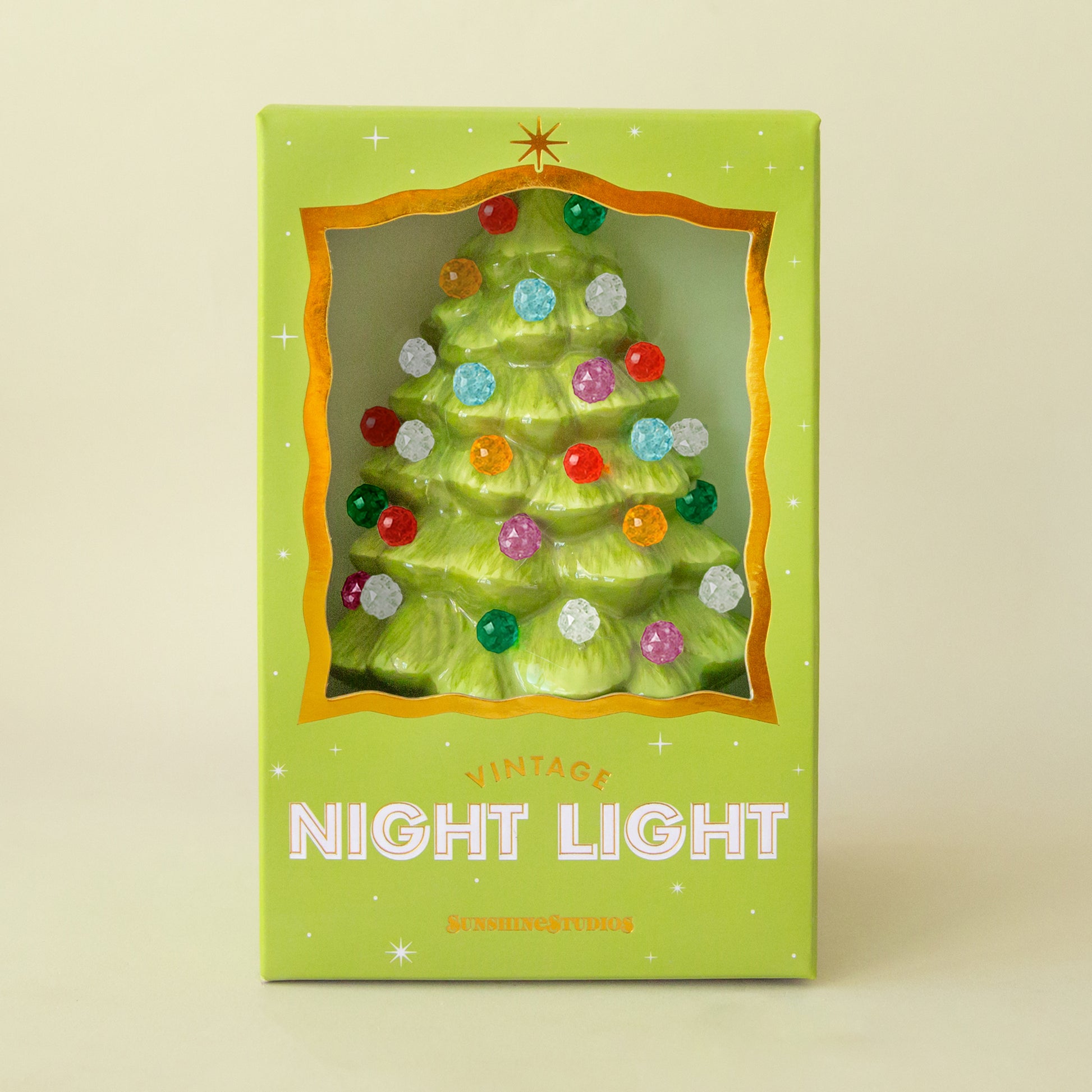 Lime green christmas tree night light with multi colored round bulbs in a decorative box. 