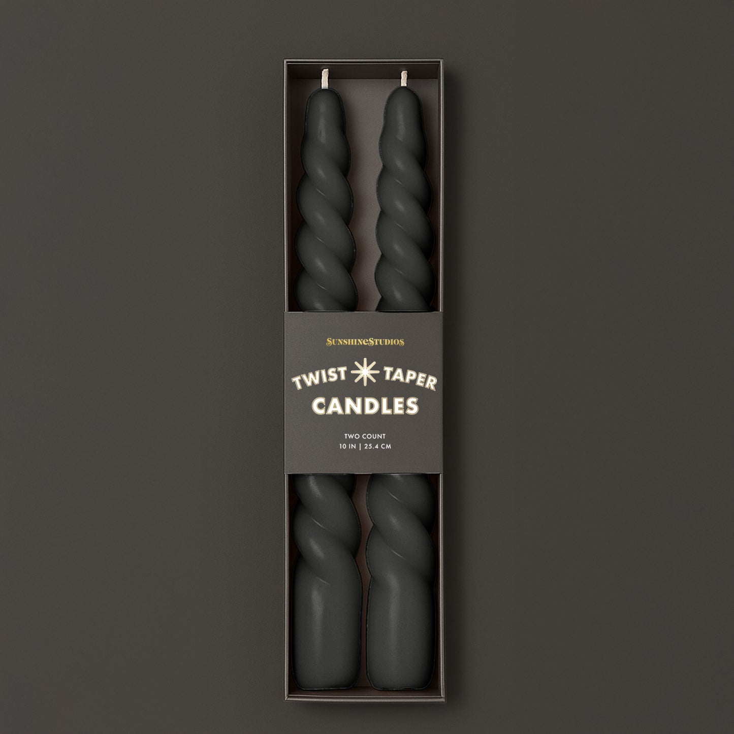 A black set of twisted taper candles. 