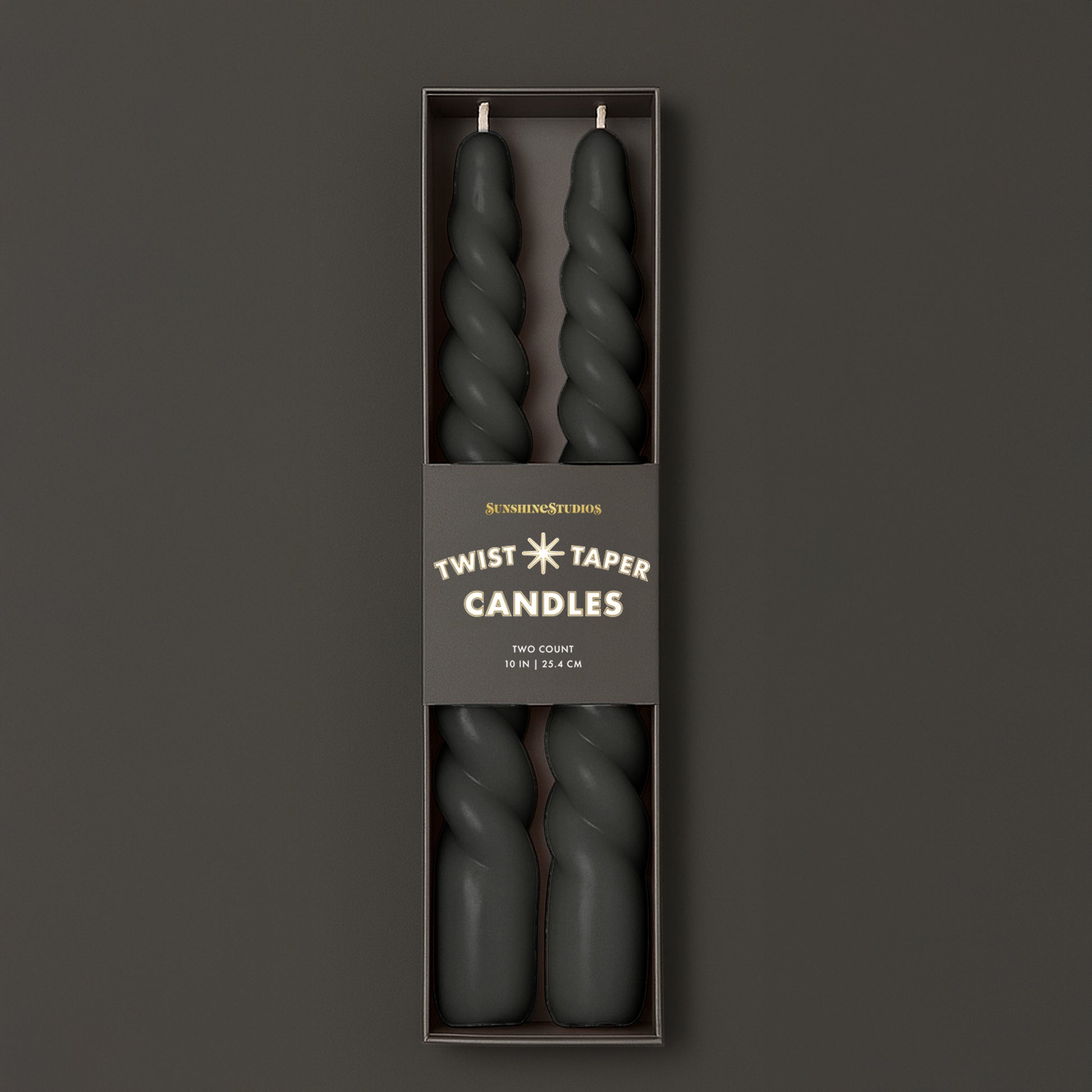A black set of twisted taper candles. 