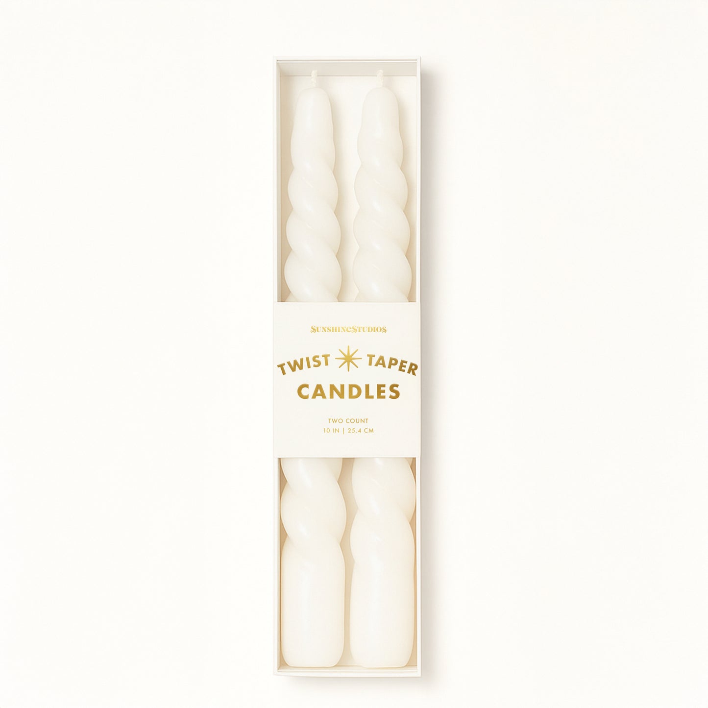 A pair of twisted white taper candles. 