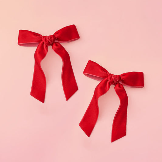 A set of red hair bows. 