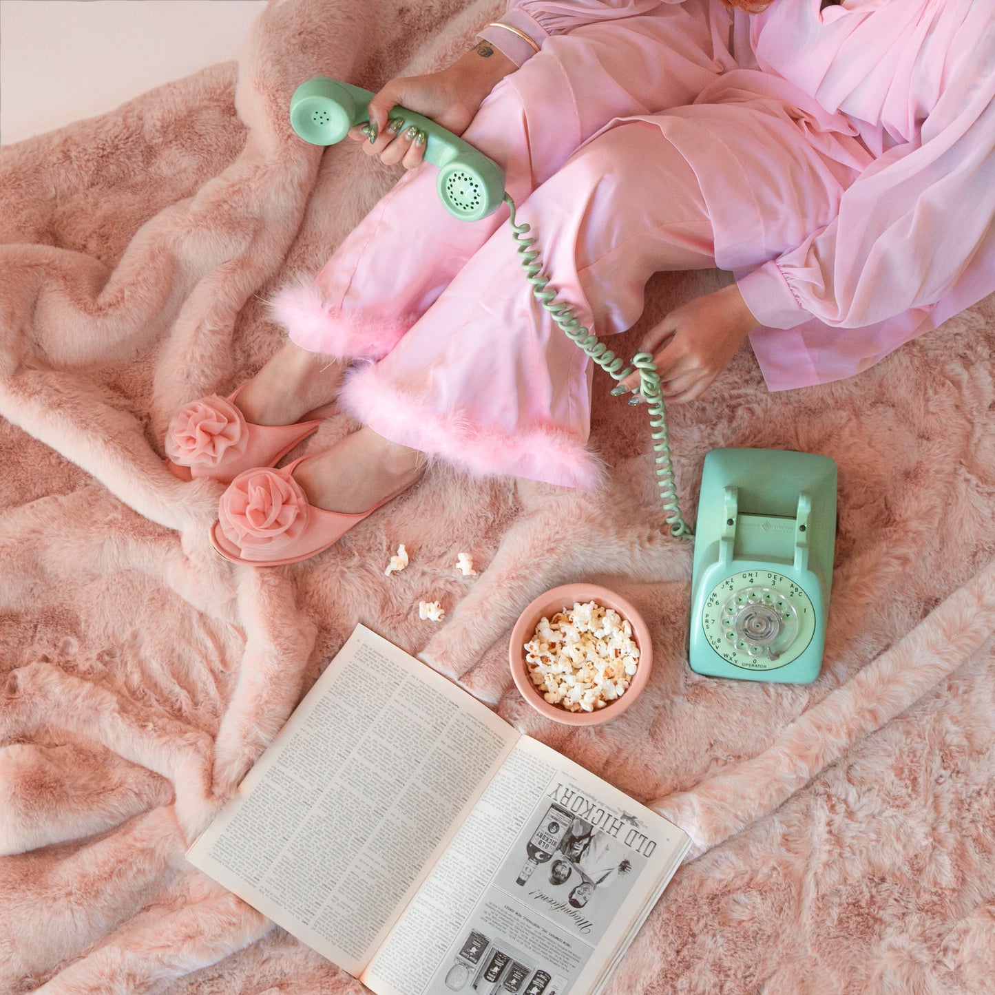 A light pink faux fur blanket. 