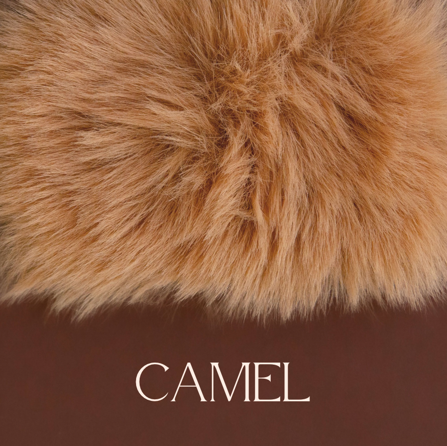 A camel colored faux fur blanket. 