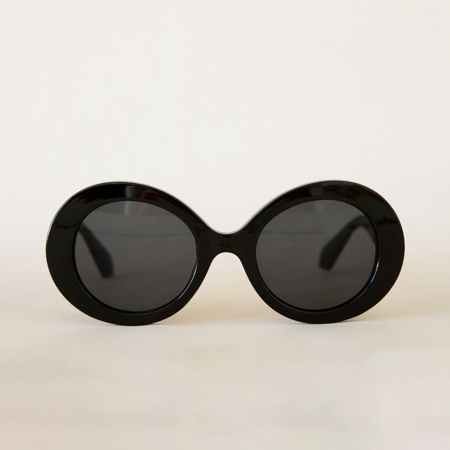 A black round pair of sunglasses. 