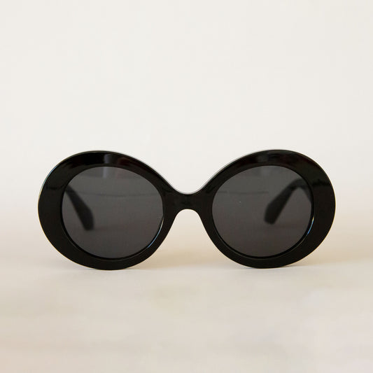 A black round pair of sunglasses. 