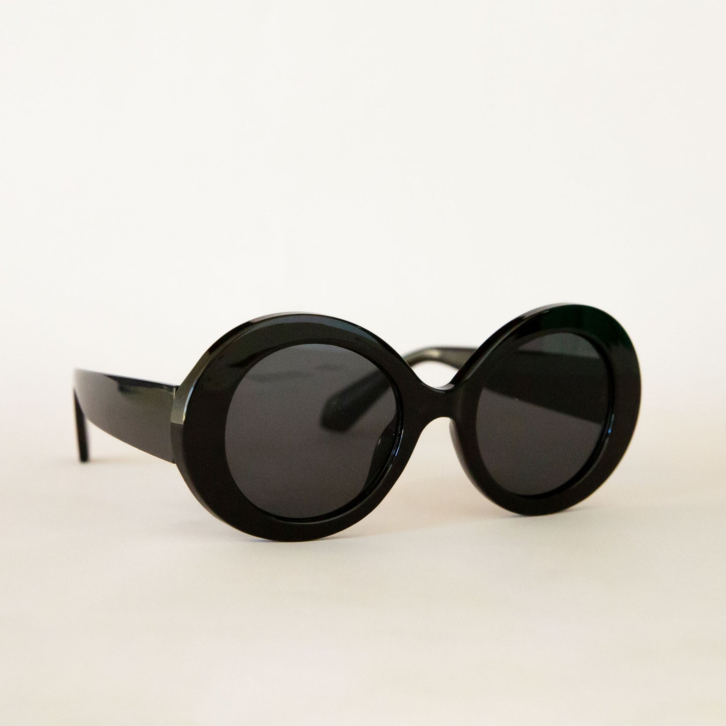 A black round pair of sunglasses. 