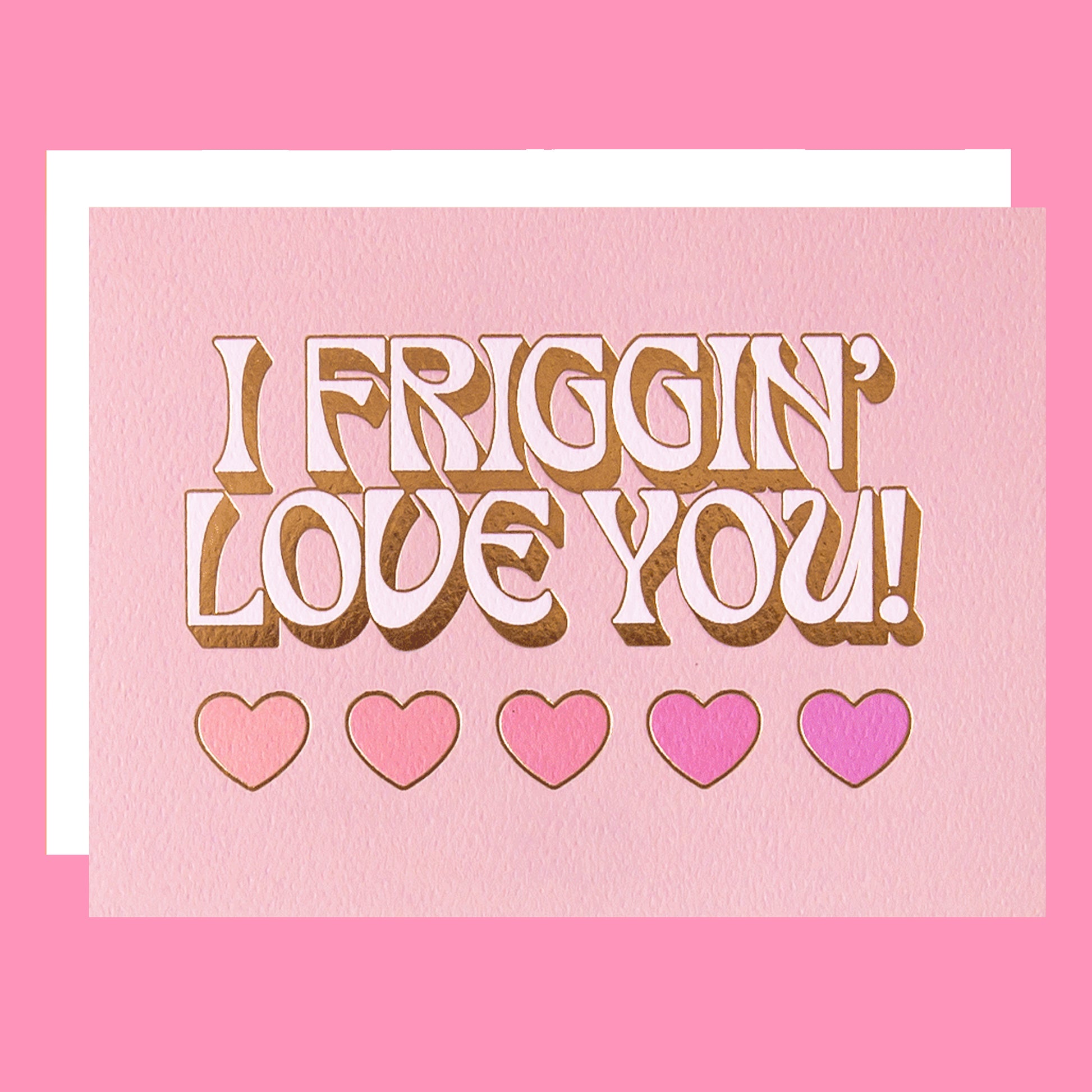 On a pink background is a light pink card with text that reads, "I Friggin' Love You!" with five hearts underneath and staged next to a heart shaped sucker that is not included with purchase.