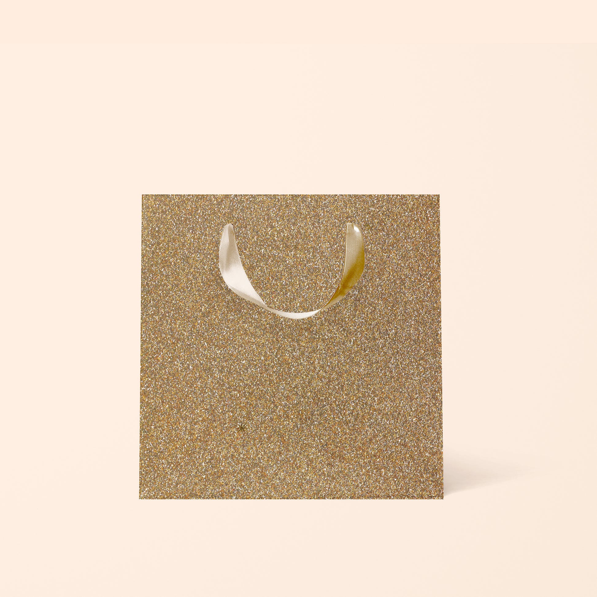 A gold sparkle gift bag. 