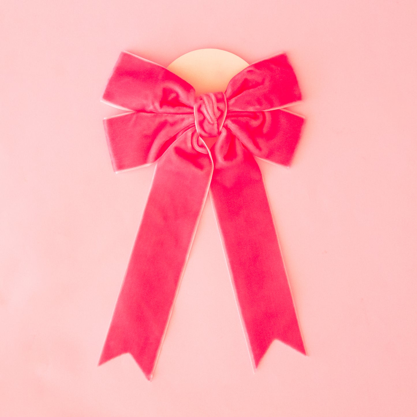 A large velvet pink bow.