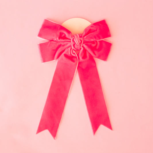 A large velvet pink bow.