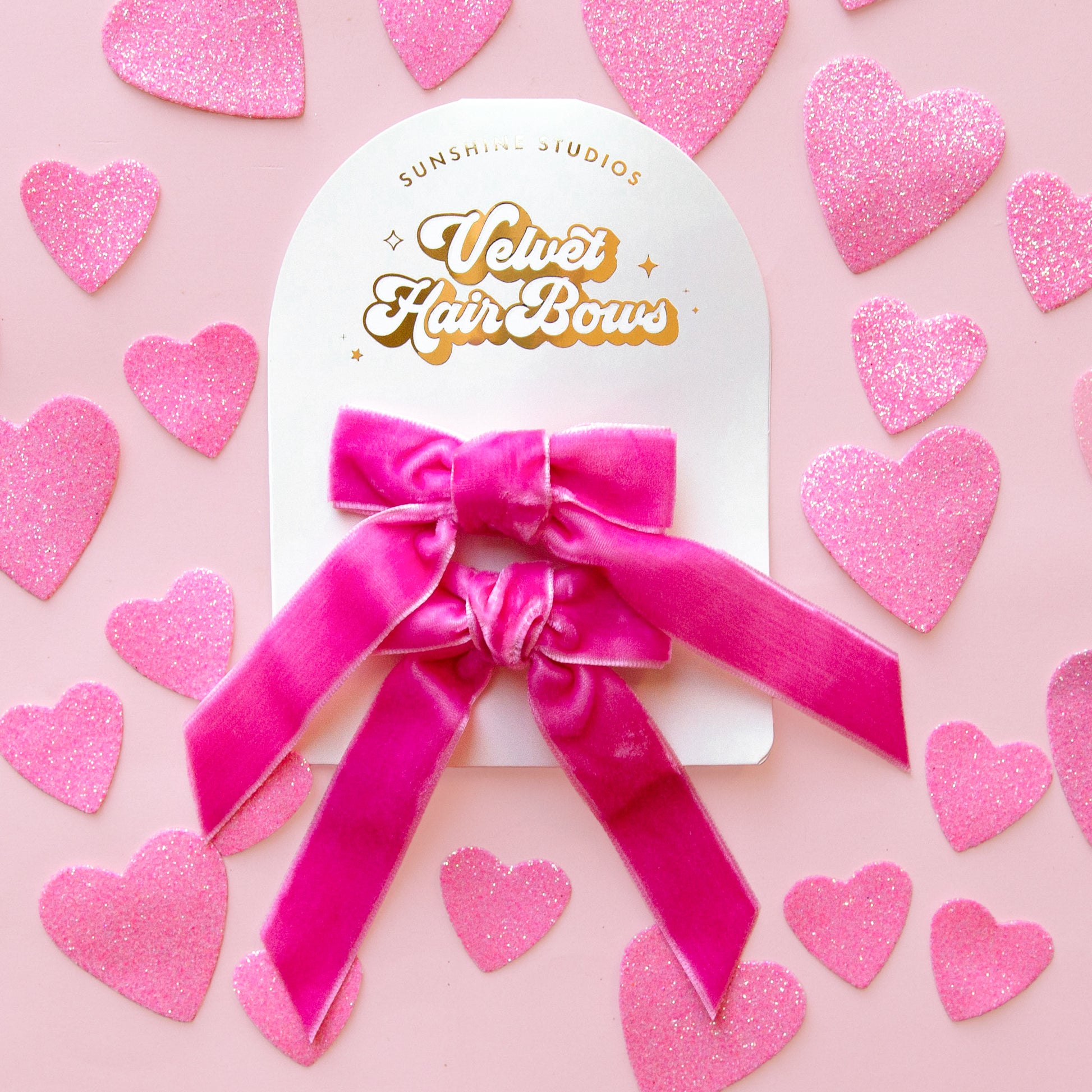 A pink set of hair bows. 