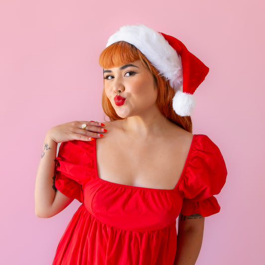 A red Santa hat with white accents and faux fur. 