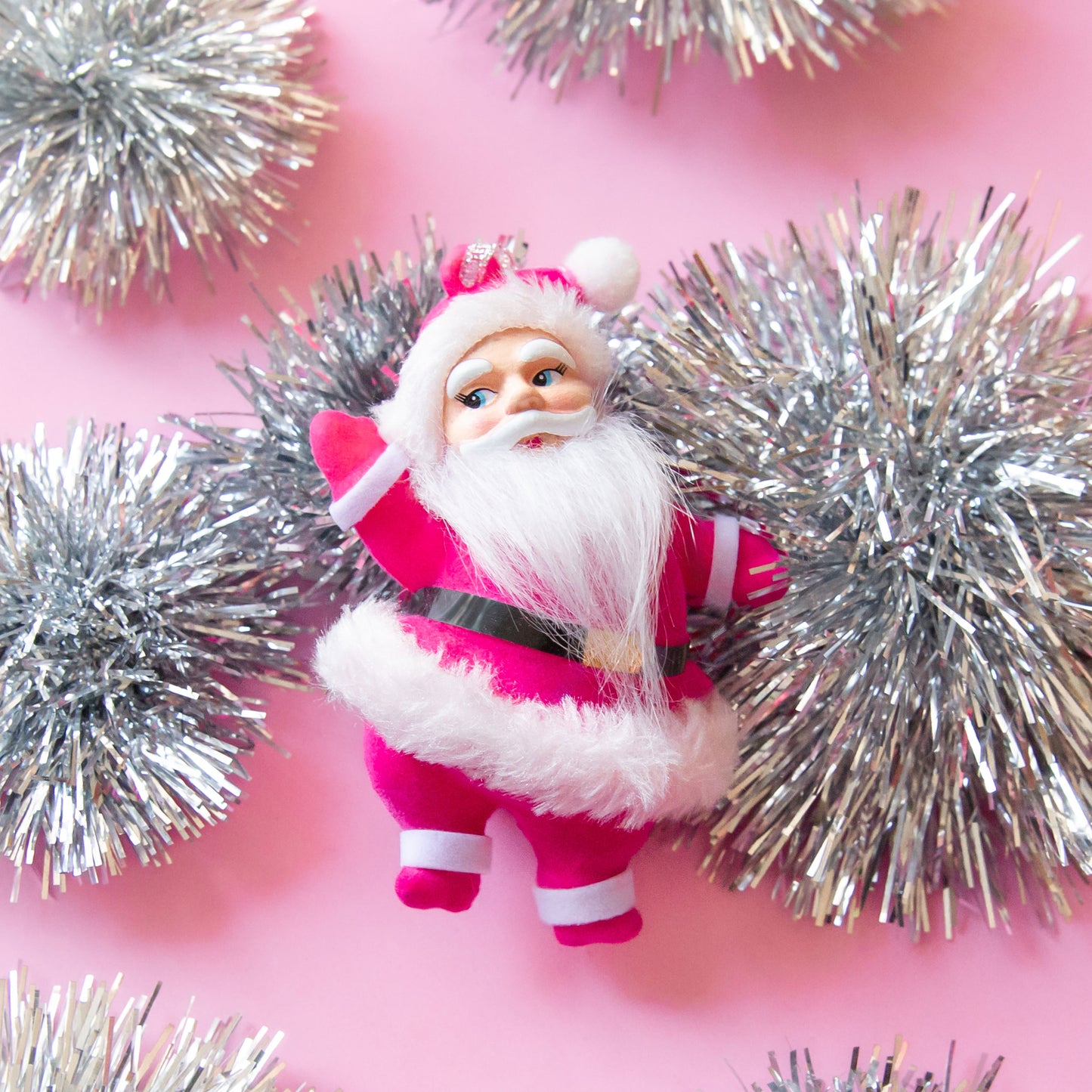 santa figure ornament with hot  pink coat