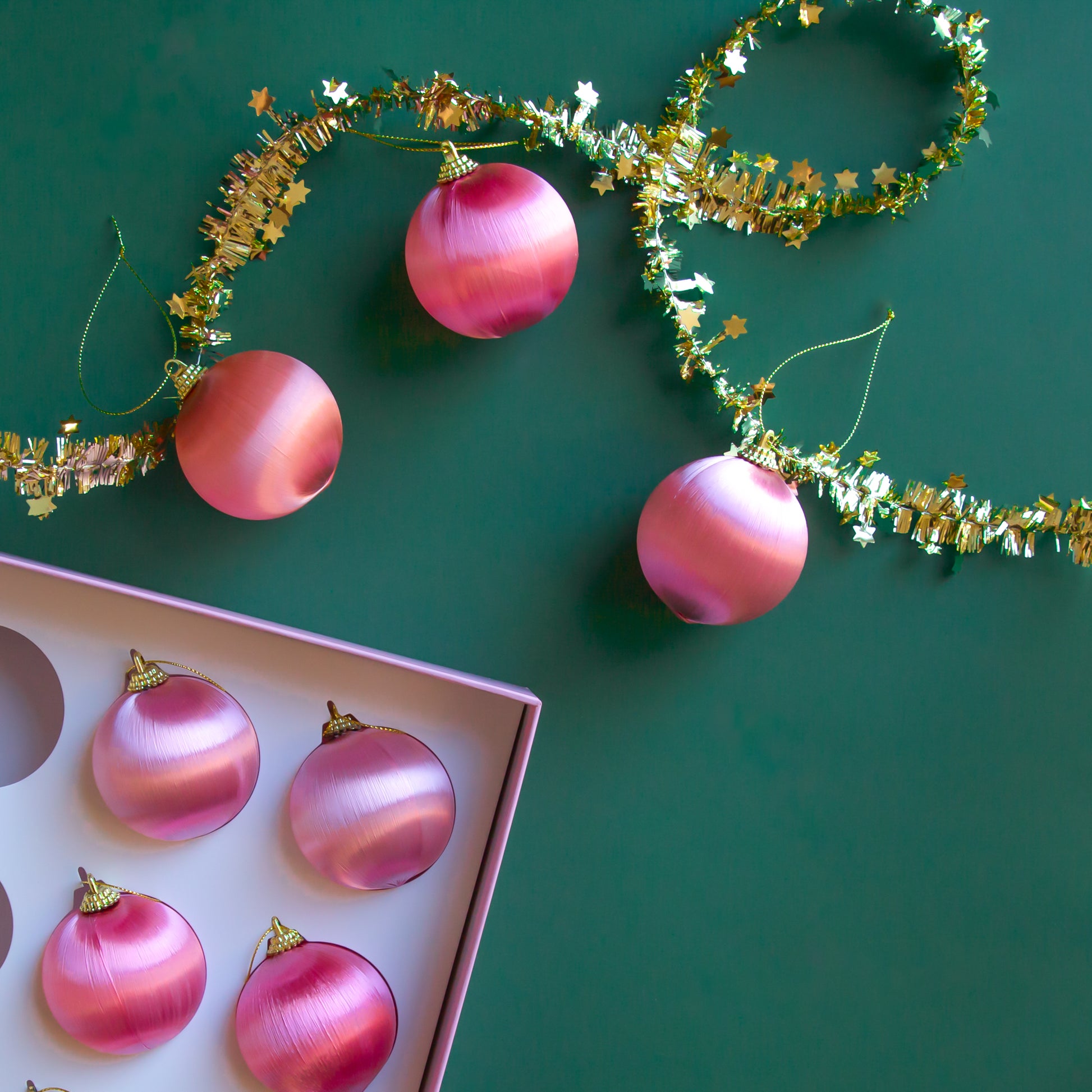 Satin and gold pink and orange ornaments. 