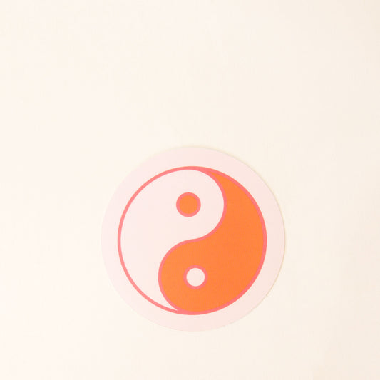 Pale pink 'Yin-Yang' design sticker with a contrasting tangerine half and deep pink border.