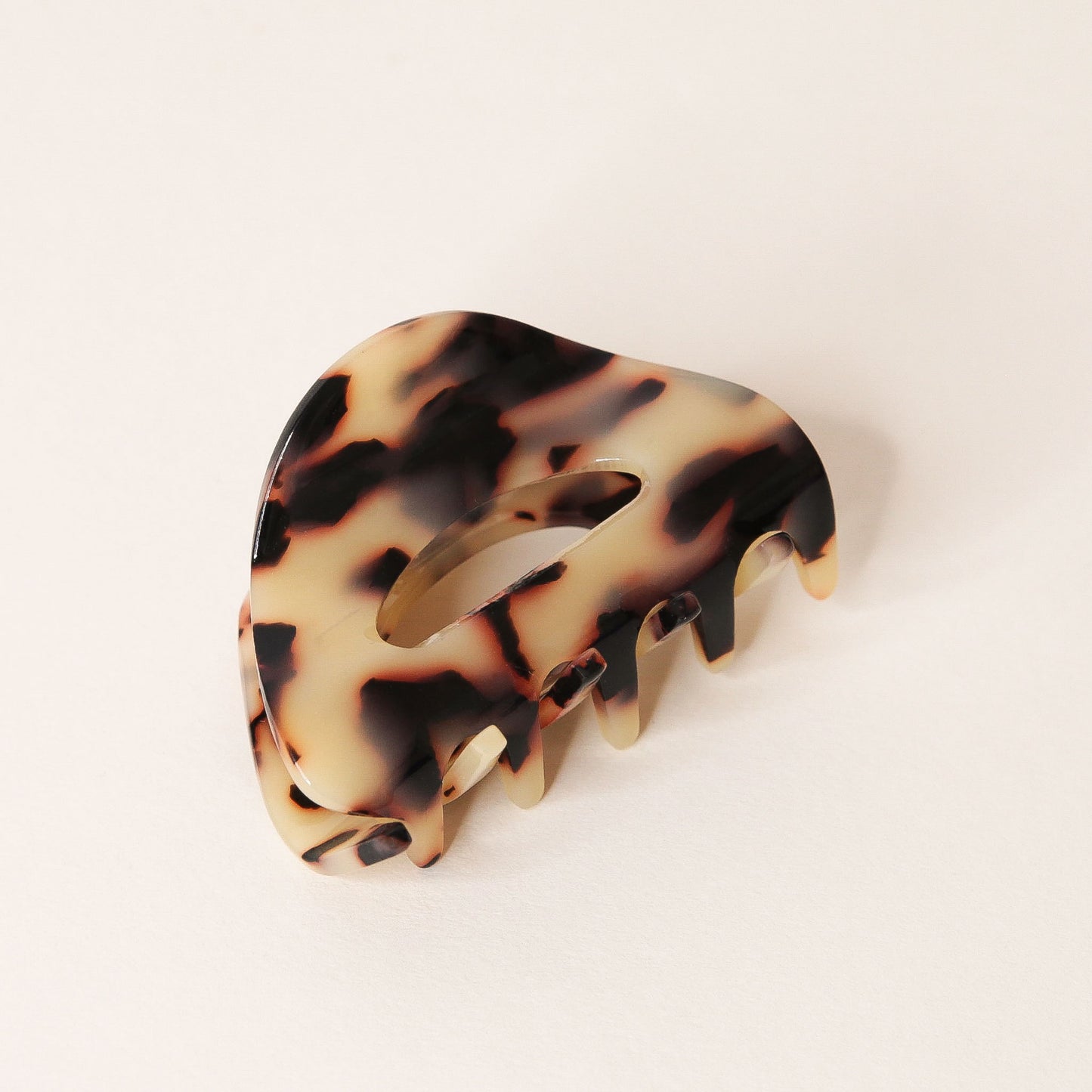 Tortoise claw hair clip with rounded edges and two simple oval cutouts.