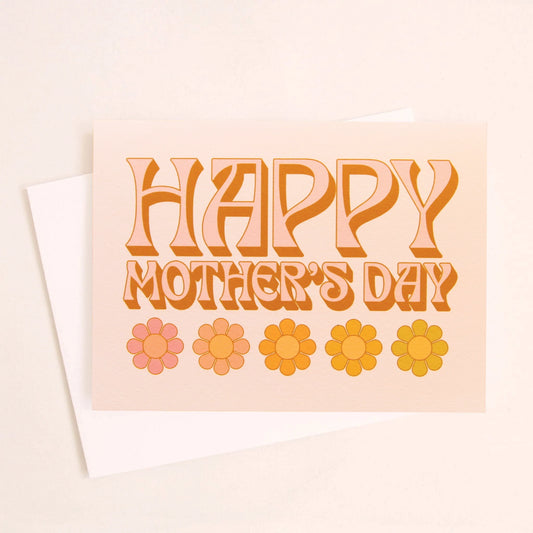 A light tangerine card with text that reads, "Happy Mother's Day" in orange letters and give daisy graphics along the bottom of the card as well as a white envelope.