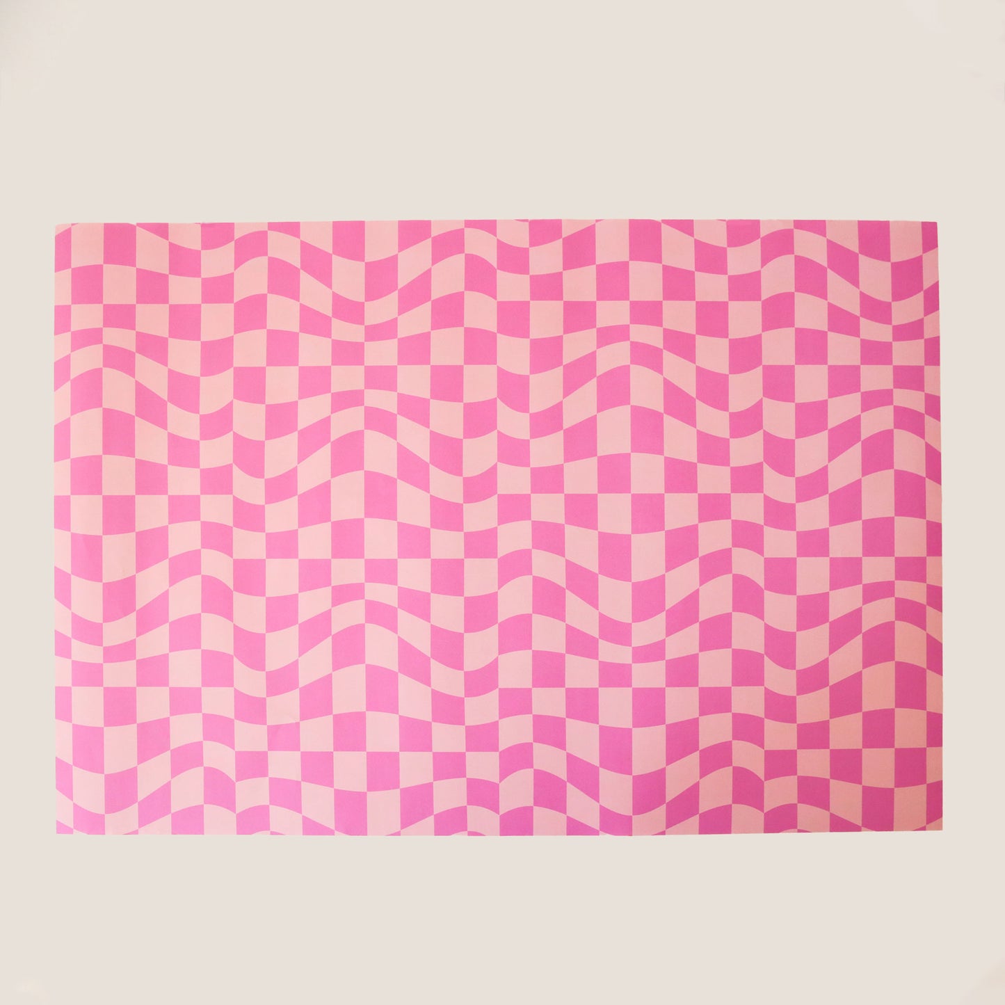 Sheet of distorted pink checkered wrapping paper.