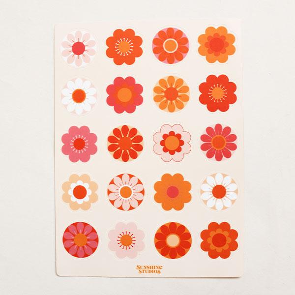 Sticker sheet filled with rows of vibrant flowers in various shapes and colors. The sticker sheet is filled with oranges, reds and pinks.