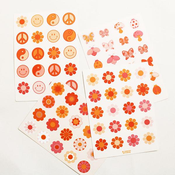 Four pages of sticker sheets filled with various 70 inspired designs including bus flowers, smiley faces, peace signs and more. Each sticker sheet has a vibrant orange, pink and red array of colors. 